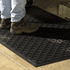 Comfort Scrape™ Mat black anti-fatigue industrial mat with high-traction surface and beveled edges for grease and oil resistance